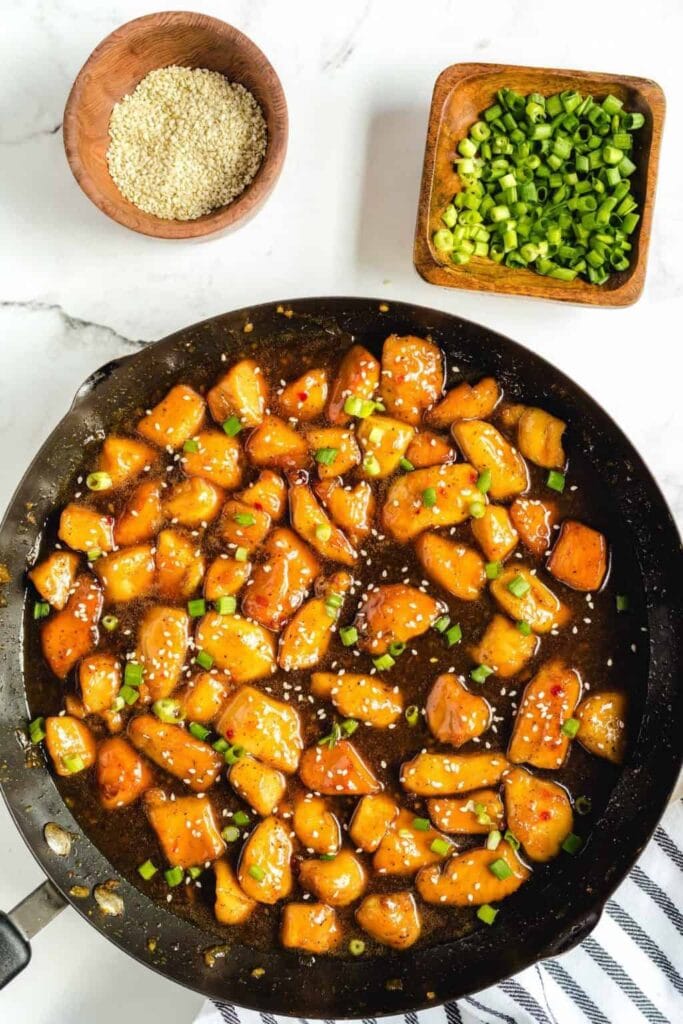 Honey garlic chicken in a skillet.