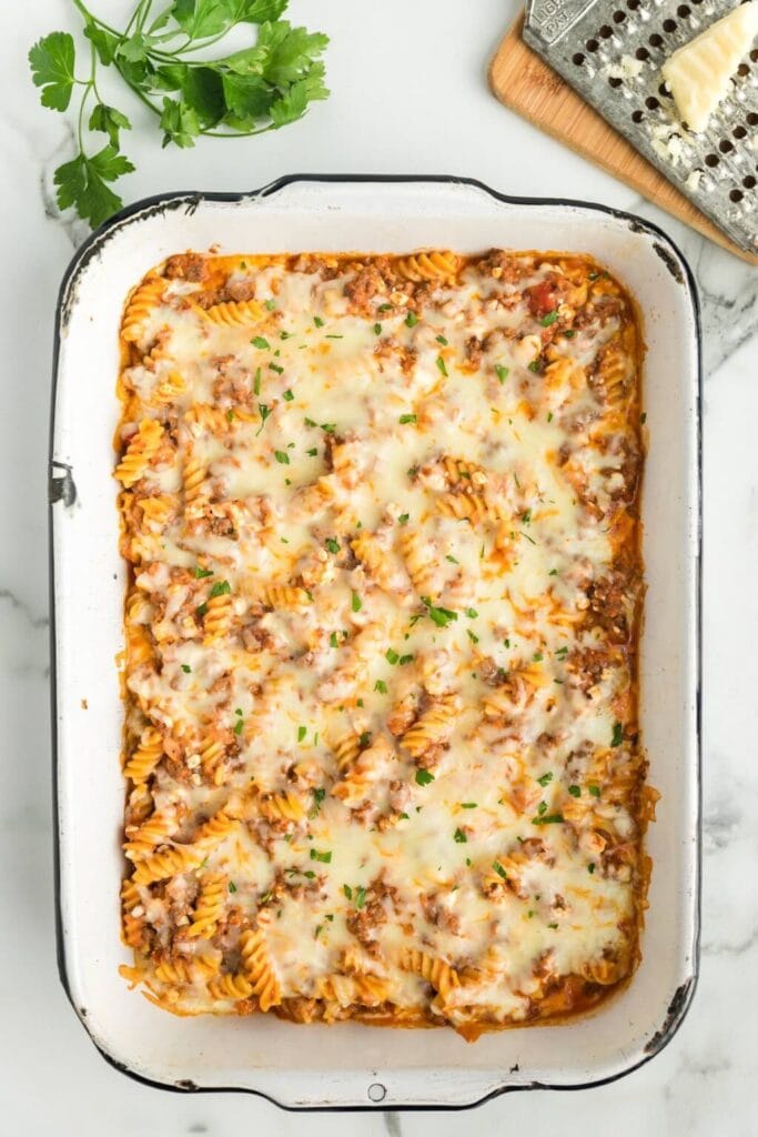 Lasagna casserole with melted cheese in a baking dish.