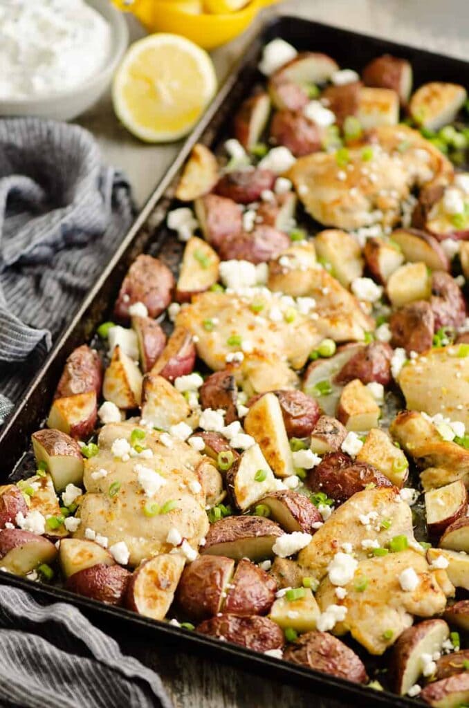 Lemon Feta Sheet Pan Chicken Thighs and Potatoes with crumbled feta.