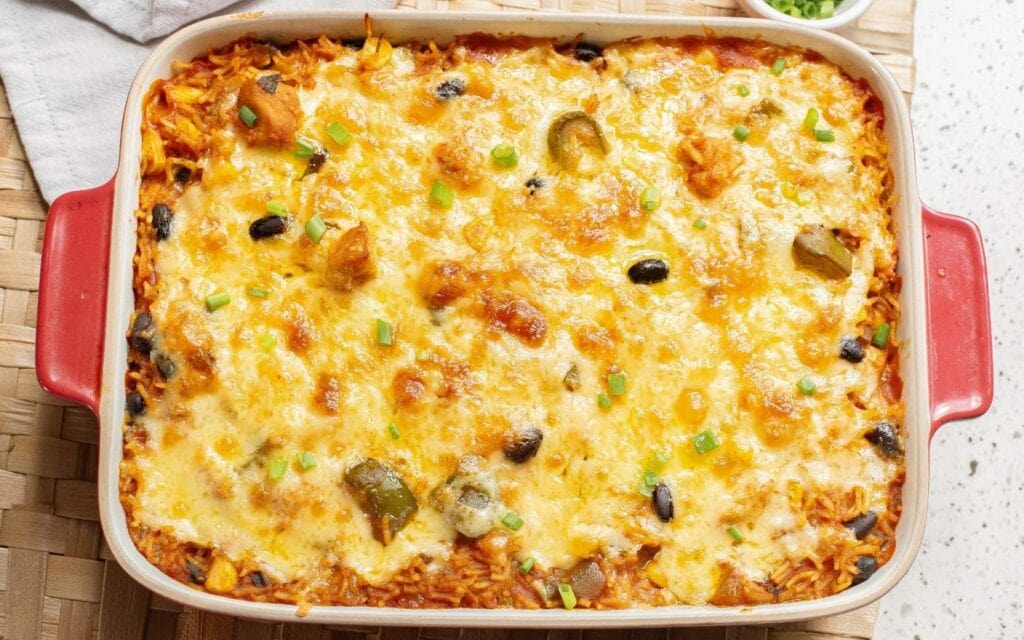Mexican chicken casserole with melted cheese.