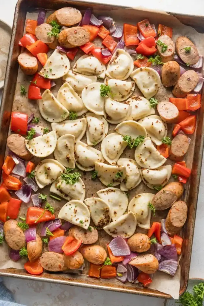 Mini Pierogies Sheet Pan Dinner on a baking sheet in an overhead view.