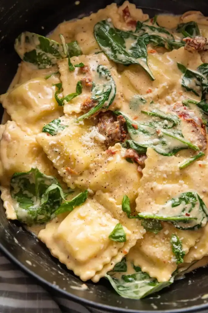 Close-up of one pan creamy Tuscan ravioli.