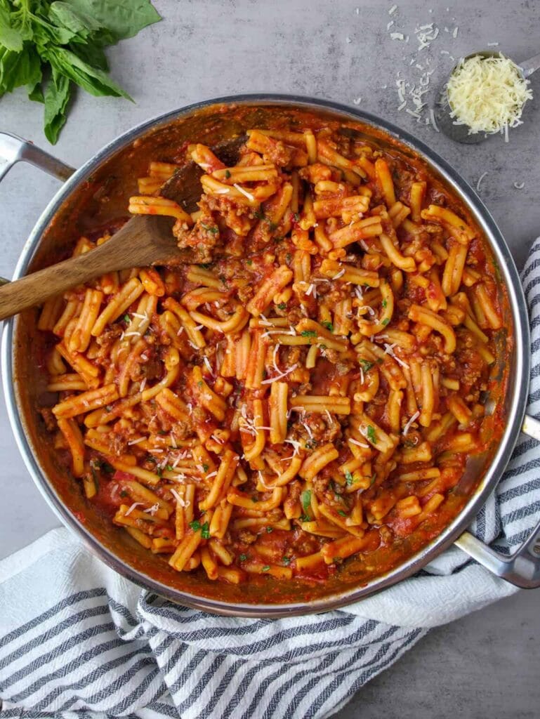 Overhead shot of Italian sausage pasta in a pot.