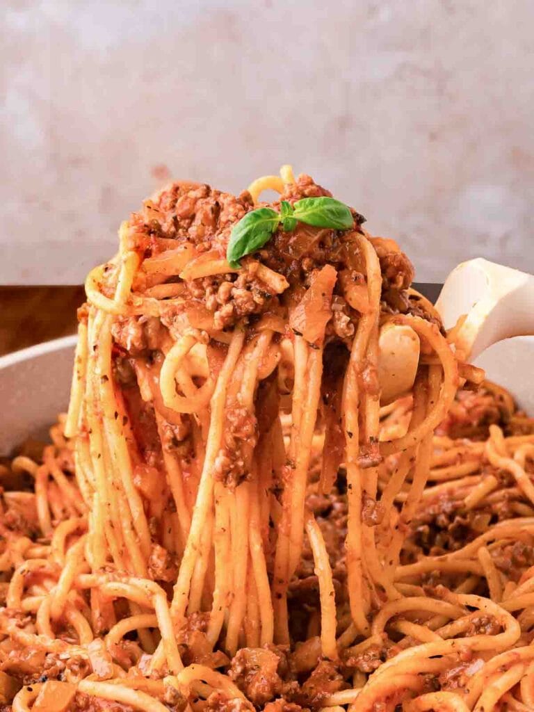Close-up of spaghetti on a serving spoon.