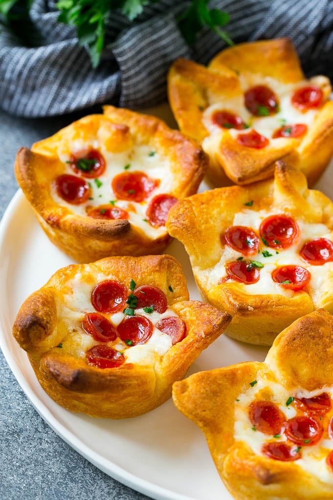 Pizza muffins on a plate.