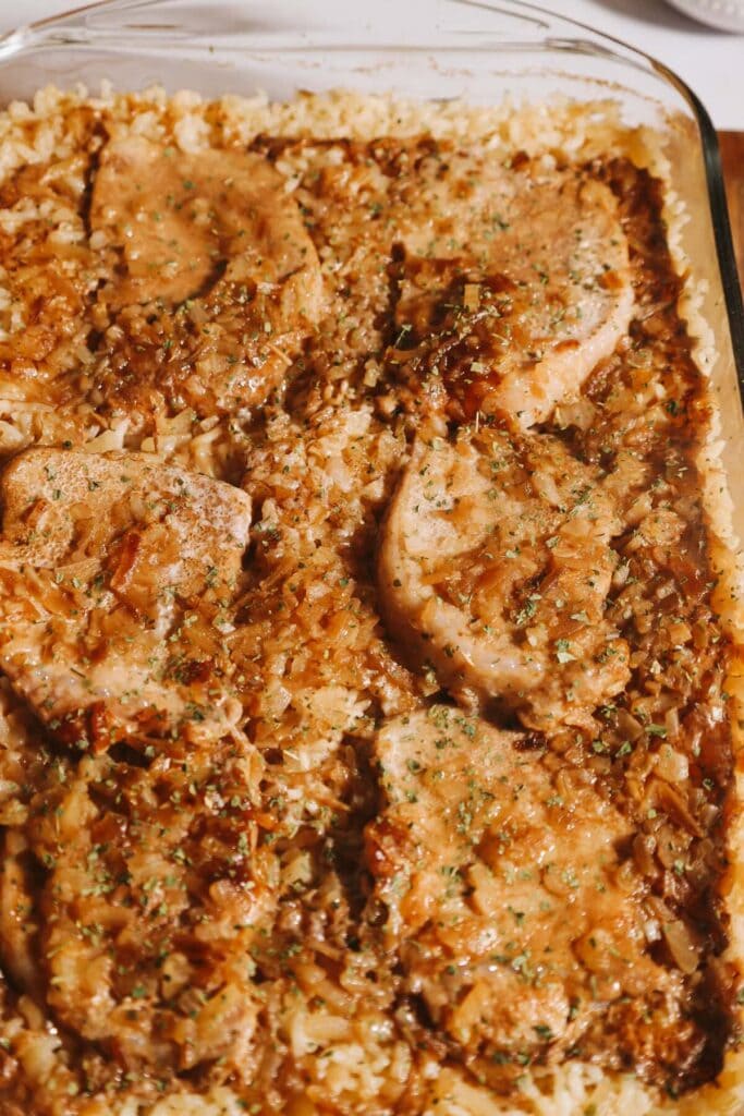 Pork chop rice casserole in a baking dish.