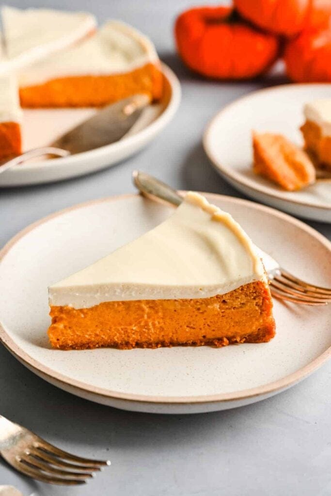 Pumpkin cheesecake served on a plate.