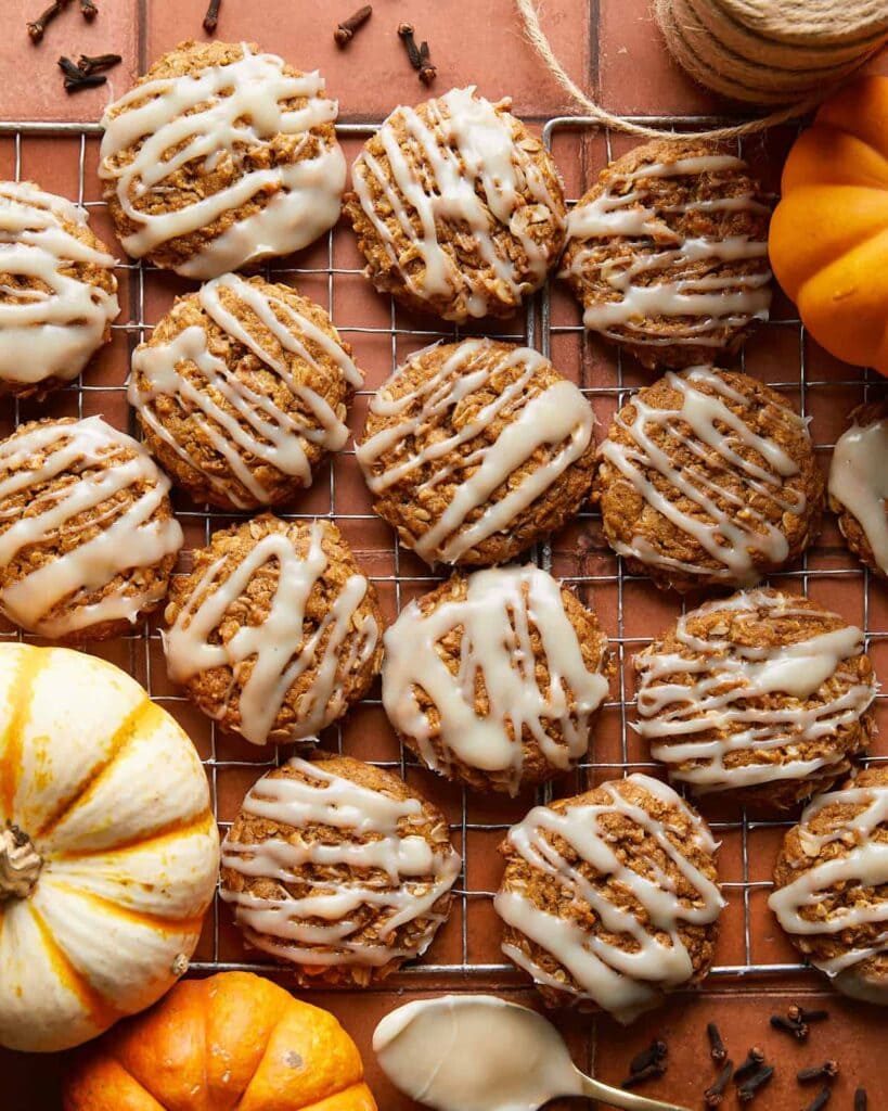 Oatmeal cookies on background with pumpkins