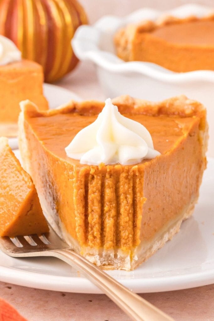 Pumpkin pie served on a plate.