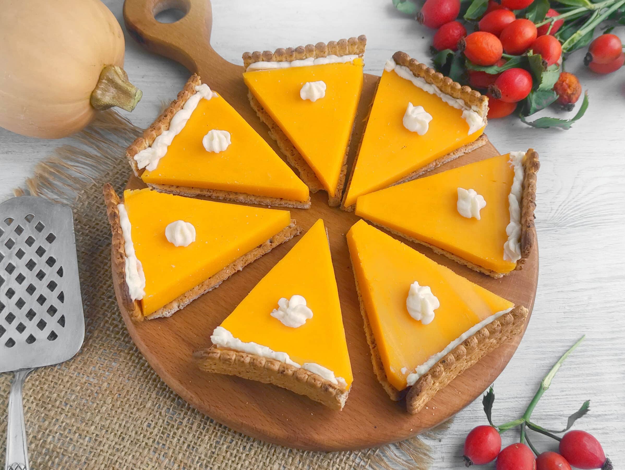 Pumpkin pie cheese and crackers on a wooden board.