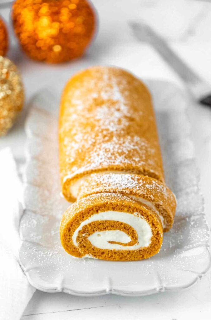 Pumpkin roll on a plate.