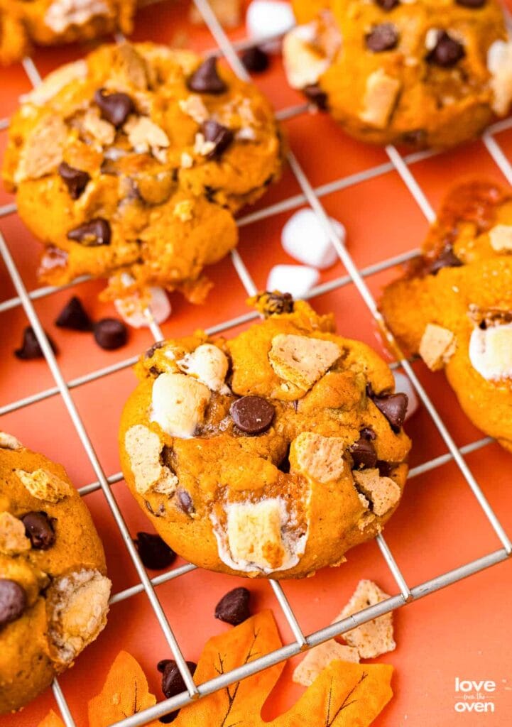 Pumpkin s’mores cookies on a cooling rack.