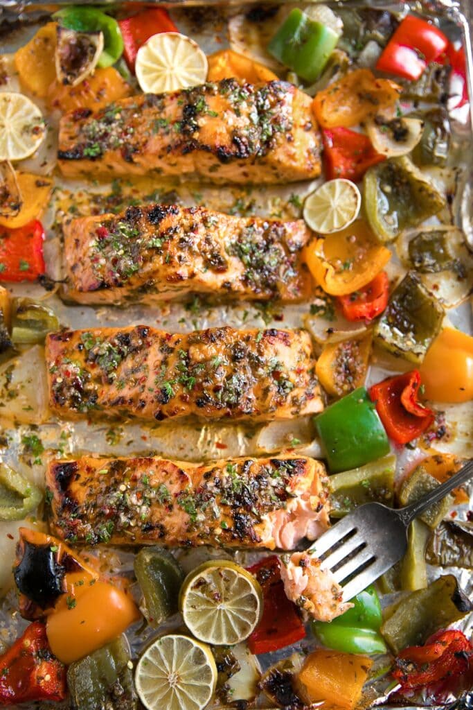 Chili Lime Orange Salmon on a baking sheet in an overhead view.