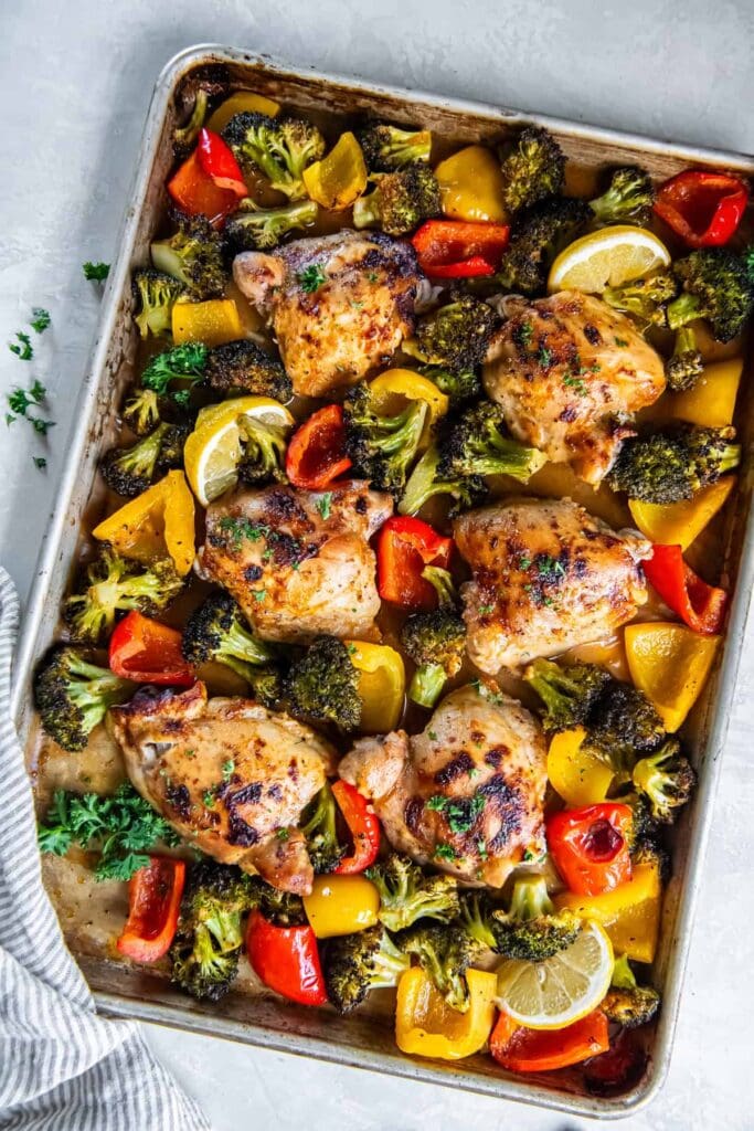 Honey mustard chicken thighs on a sheet pan.