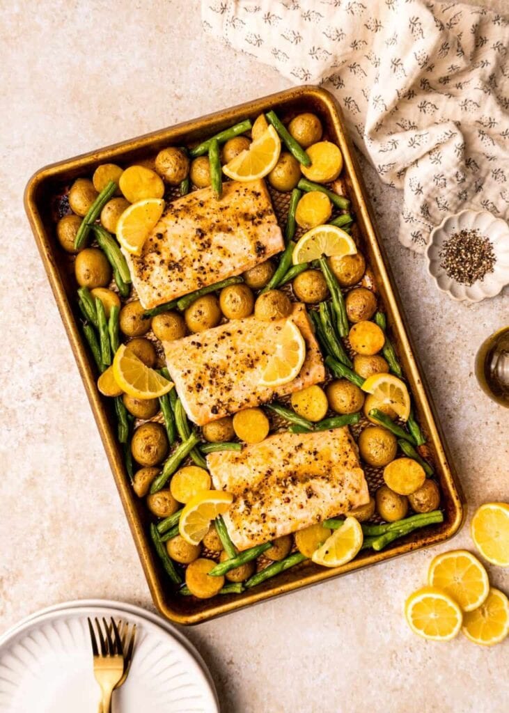 Lemon pepper salmon on a sheet pan.