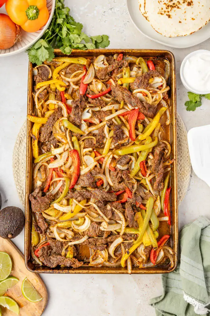 Sheet Pan Steak Fajitas with peppers and onions.