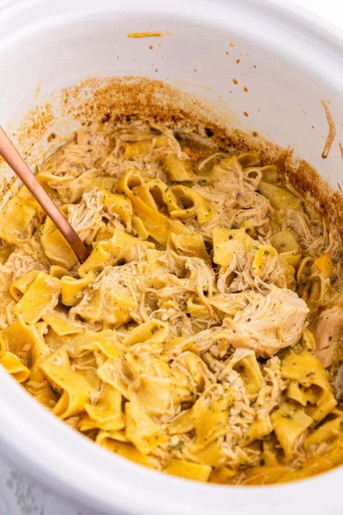 Chicken noodles in a slow cooker.