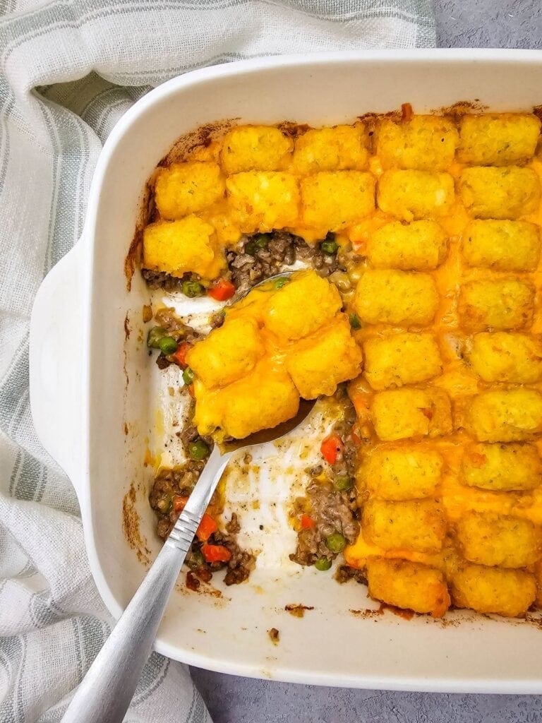 Tater Tot Casserole with Ground Beef in a baking dish.