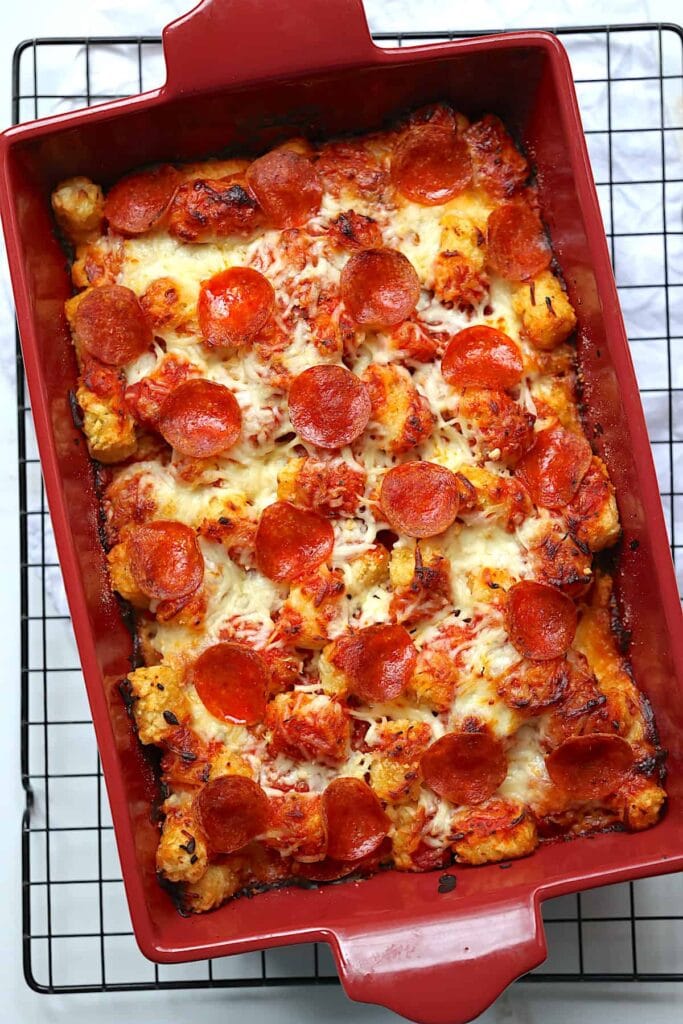 Tater tot pizza casserole in a baking dish.