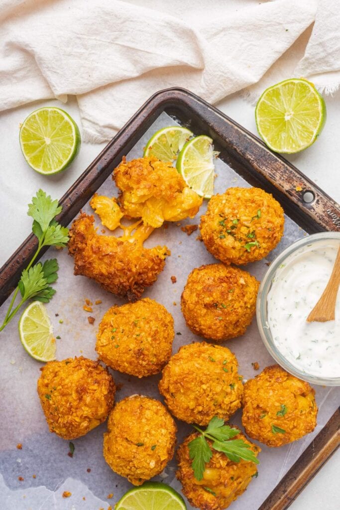 Air fryer mac and cheese balls on a baking tray.