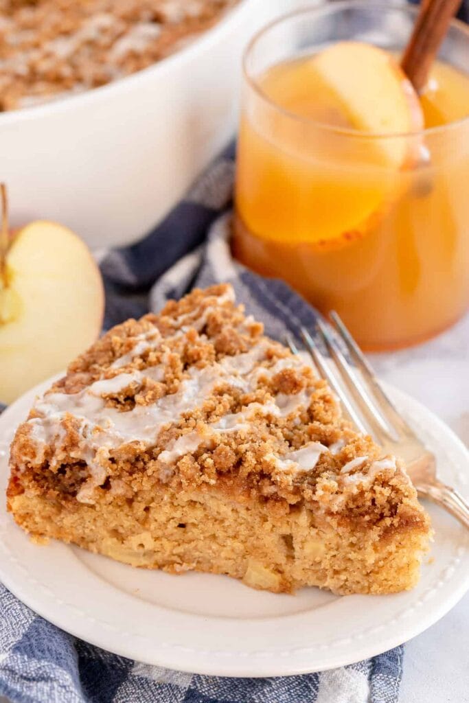 Slice of apple cider coffee cake on a plate.
