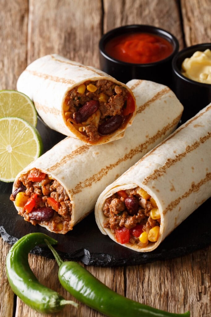 Bean burritos on a stone plate.