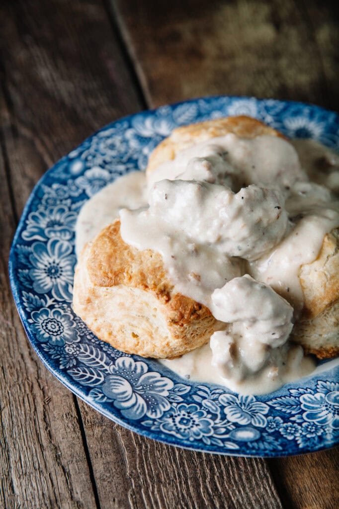 Biscuits and gravy on a plate.