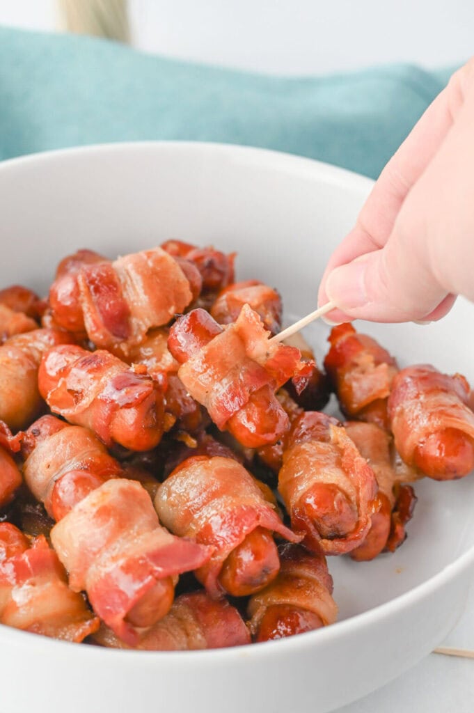 Brown sugar bacon wrapped little smokies in a bowl.