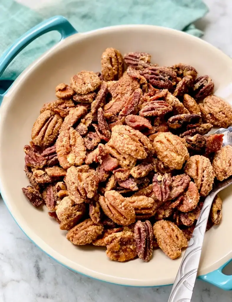 Candied bacon pecans in a bowl.