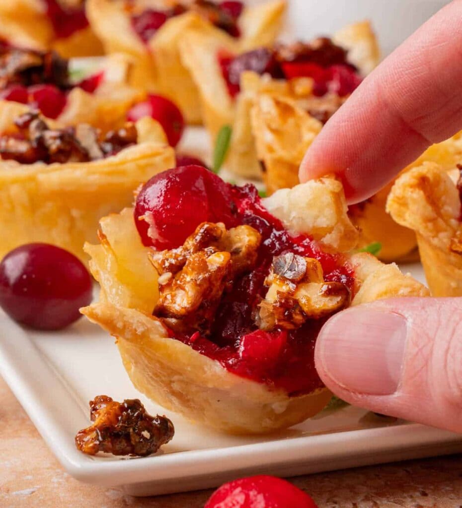 Cranberry brie bites on a plate.