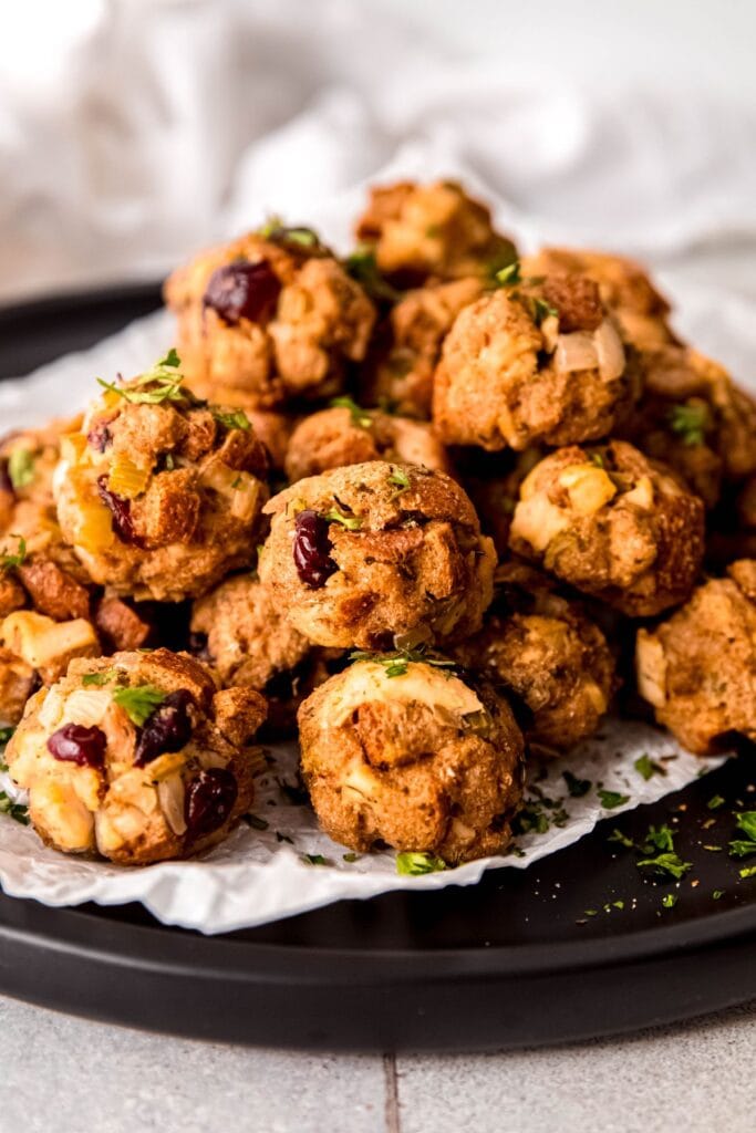 Cranberry turkey stuffing balls on a plate.
