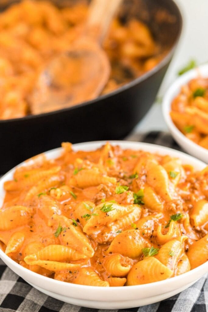 Creamy beef and shells on a plate.