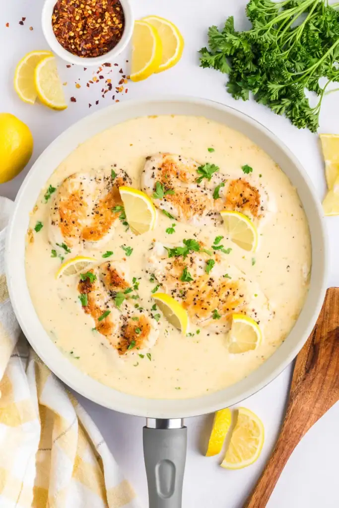 Creamy lemon chicken in a skillet.