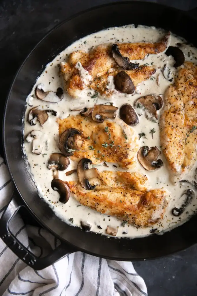 Creamy mushroom chicken in a skillet.