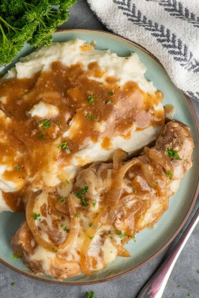 Crock Pot French Onion Pork Chops served on a plate