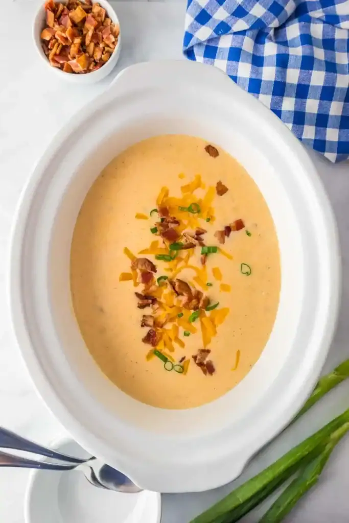 Hashbrown potato soup in a slow cooker.
