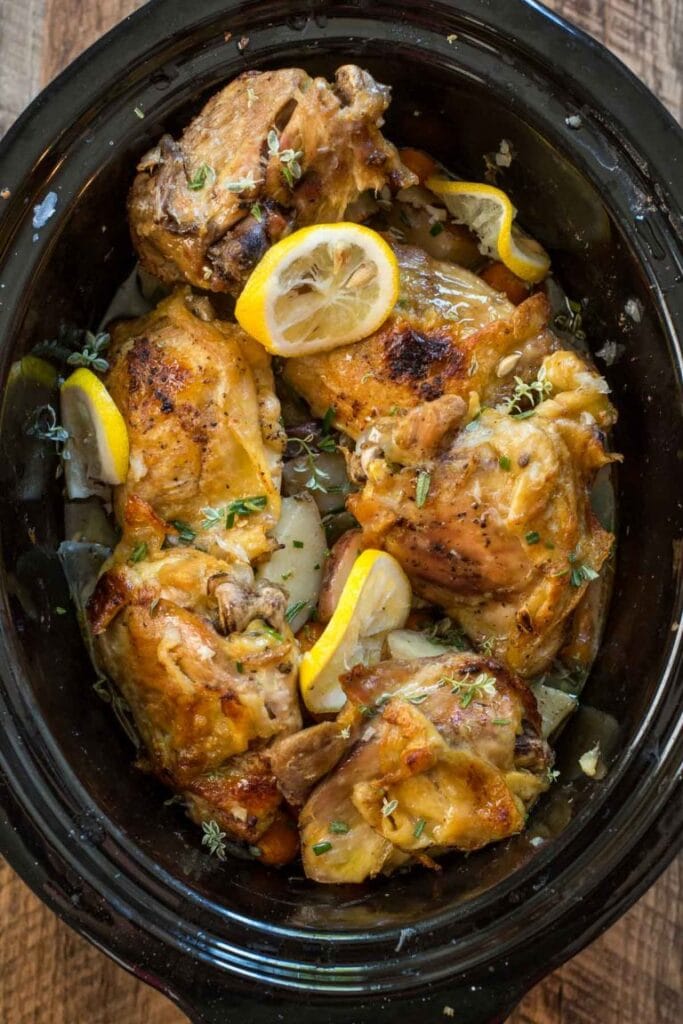 Lemon garlic chicken and veggies in a crock pot.