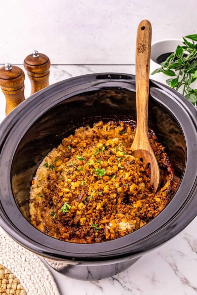 Pork chops and stuffing in a crockpot.