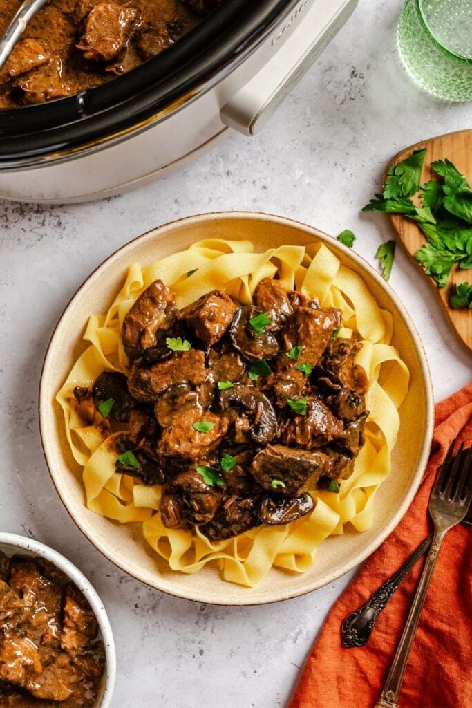 Crockpot beef with mushroom gravy on a plate.