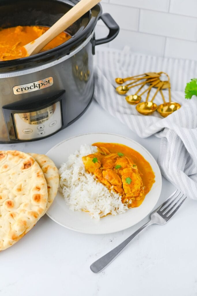 Crockpot butter chicken on a plate.