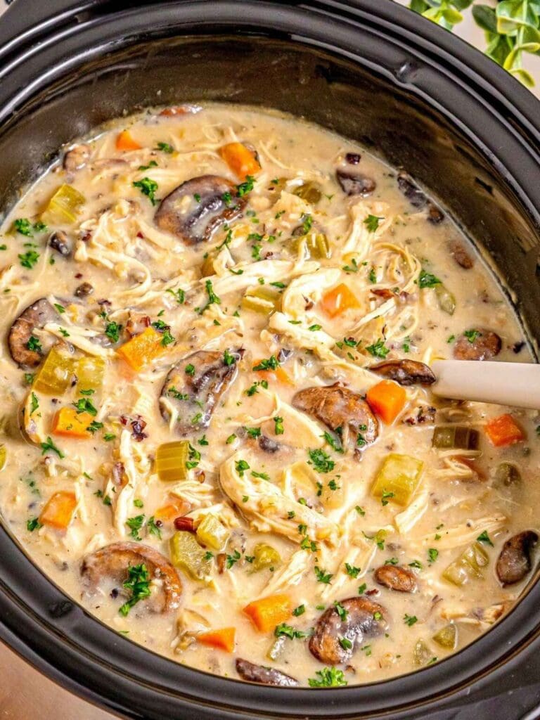 Chicken and wild rice soup in a slow cooker.
