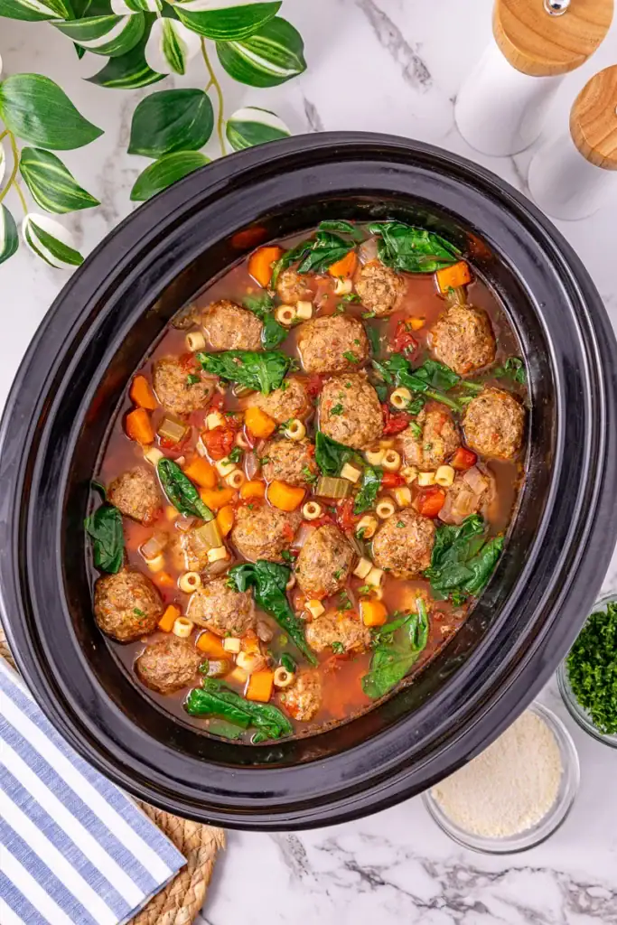 Italian meatball soup in a slow cooker.