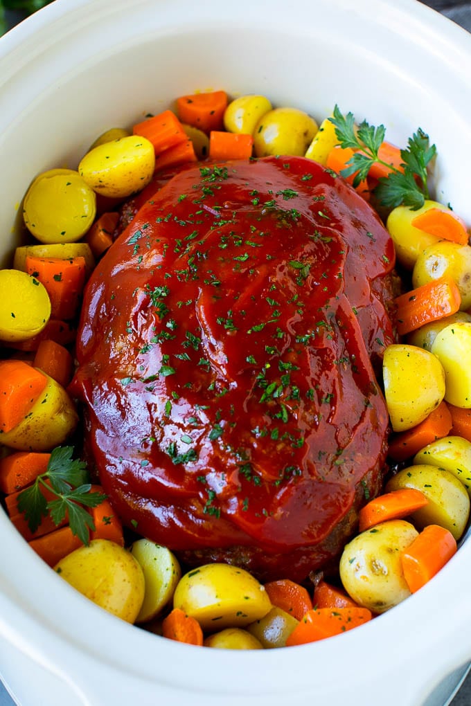 Meatloaf with vegetables in a crockpot.