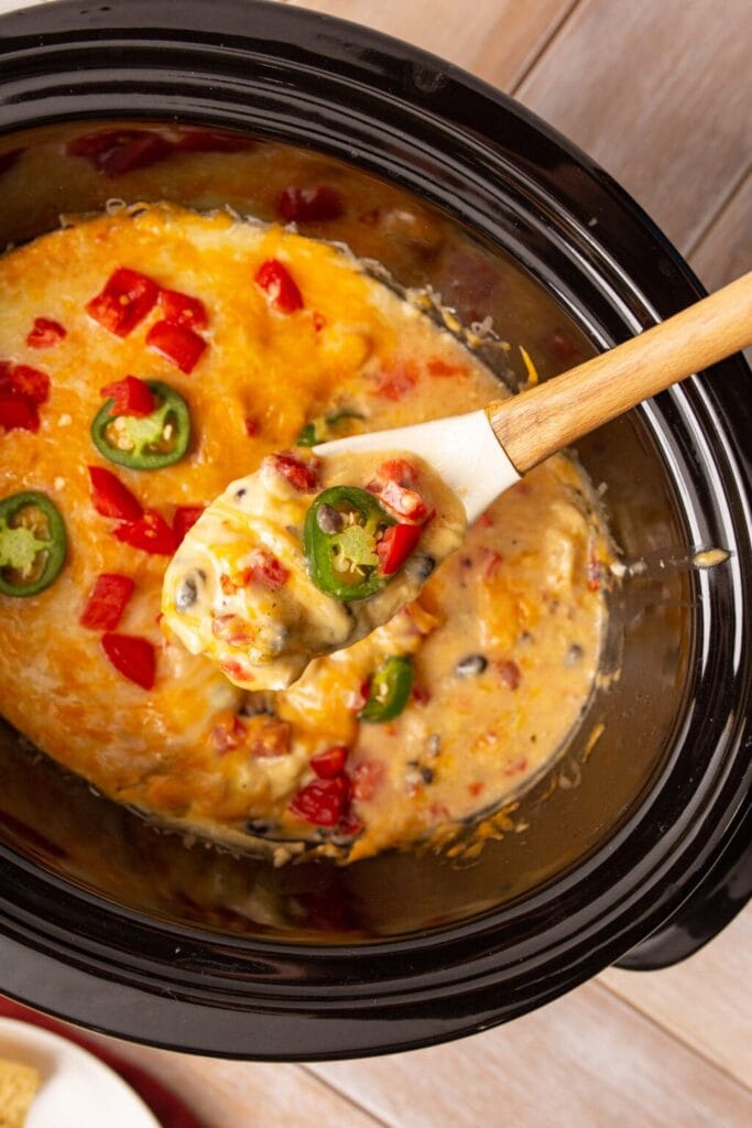 Crockpot Mexican chicken on a serving spoon.