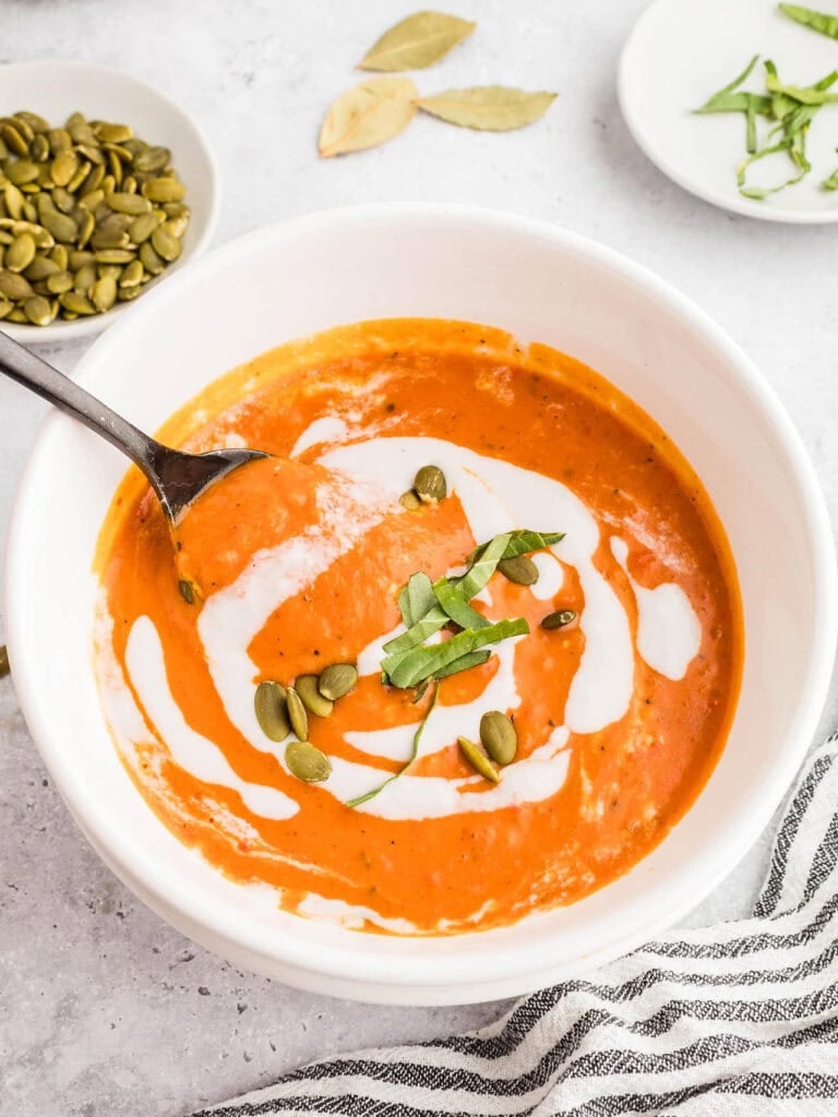 Crockpot pumpkin soup served in a bowl.