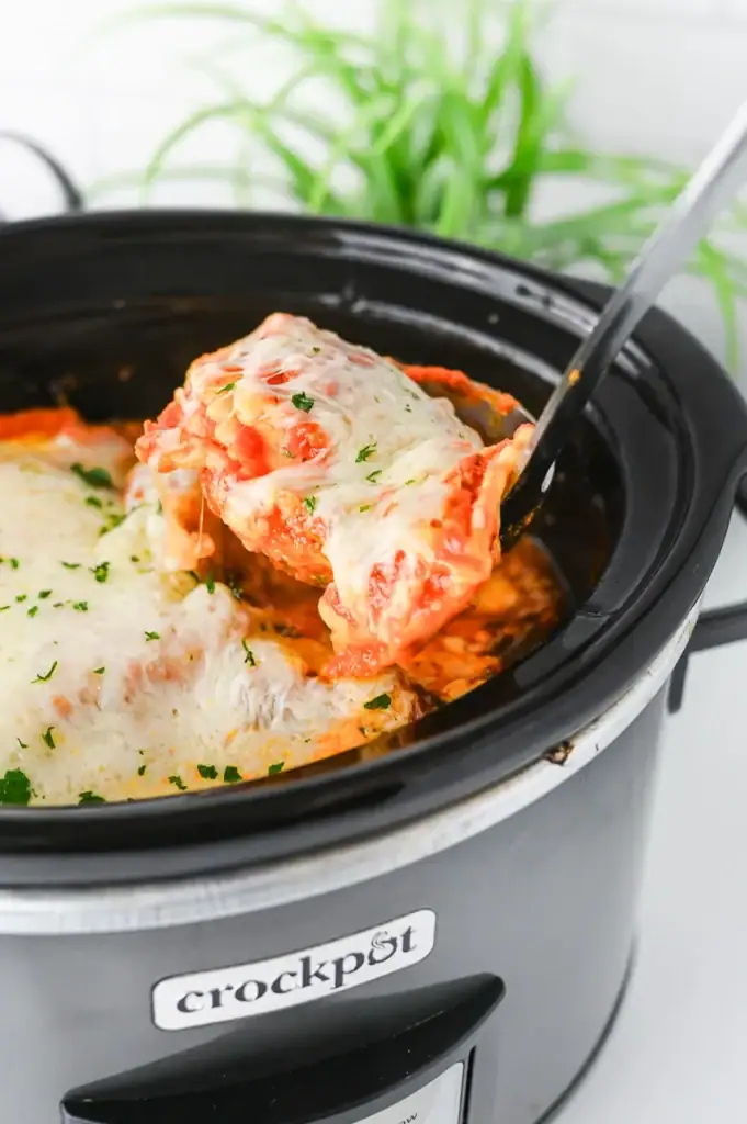 Ravioli lasagna in a crockpot.