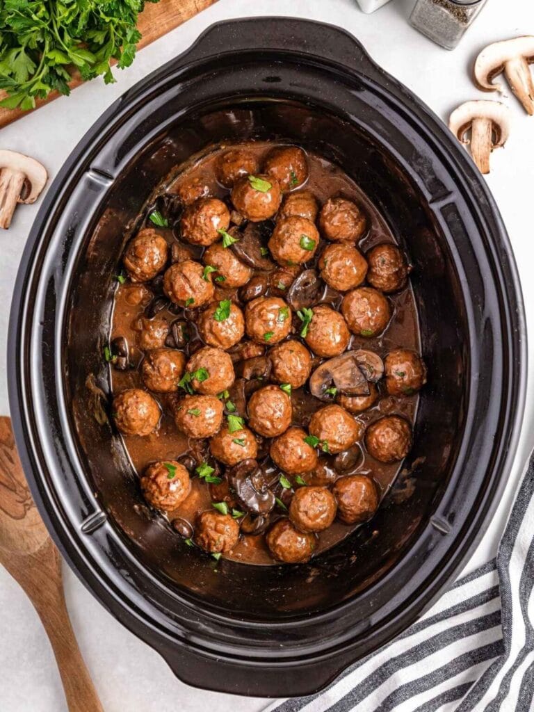 Crockpot Salisbury steak meatballs in a slow cooker.