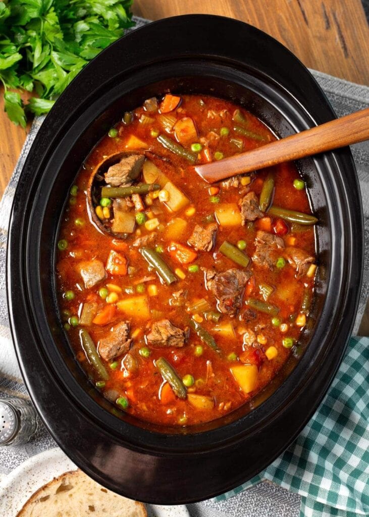 Vegetable beef soup in a slow cooker.