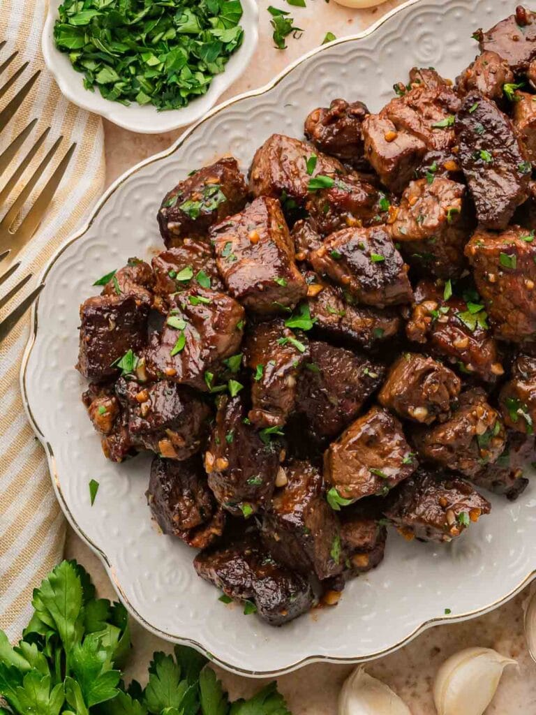 Garlic butter steak bites on a plate.