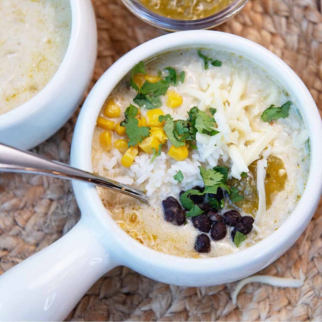 Green chile chicken enchilada soup in a slow cooker.